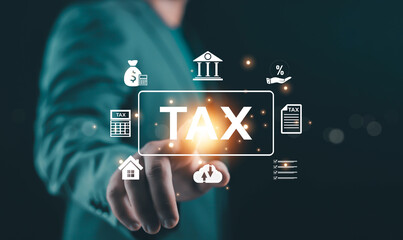 Businessman touching virtual tax interface with digital icons, online tax management concept, business finance, accounting system, government taxation, financial planning, fintech technology