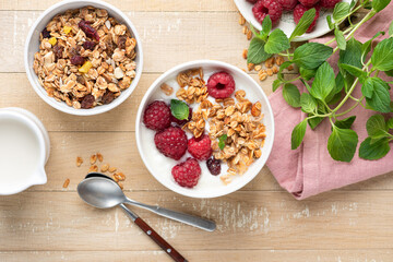 Breakfast cereal granola with raspberries and yogurt