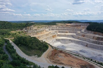 Drone aerial view of biggest Czech limestone quarry Devil's Stairs - Certovy Schody near Prague. Aerial view of industrial landscape after mining. Industry and environment in Czech Republic
