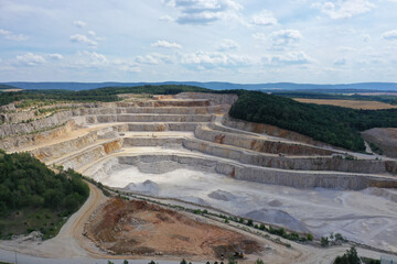 Drone aerial view of biggest Czech limestone quarry Devil's Stairs - Certovy Schody near Prague. Aerial view of industrial landscape after mining. Industry and environment in Czech Republic
