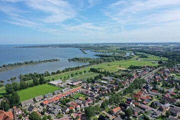 Drone photo of the village Onderdijk, near Medemblik. Surrounded by many ponds and grassland.