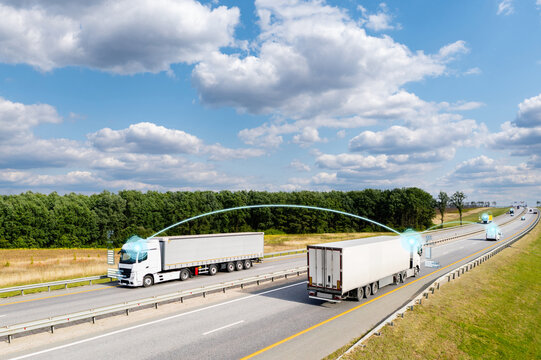 Vehicle to vehicle communication. Data exchange between trucks on a highway.