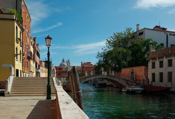 View of Venice with canal, bridge, houses and boats