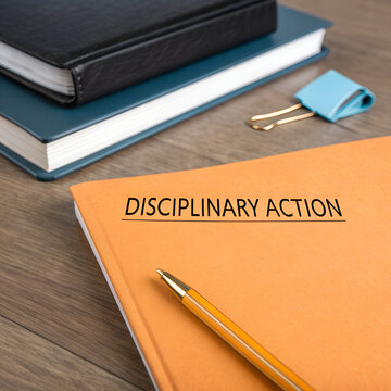 Disciplinary action documents for hr on the desk.
