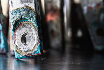 Nonferrous metal plates and patinated copper busbars with visible oxidation show aging and corrosion, symbolizing rare earth elements and price-demand shifts in metallurgical and power markets.