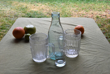 Glassware and fruits on table
