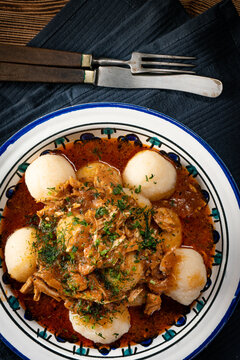 Dumplings with turkey and chorizo sauce.