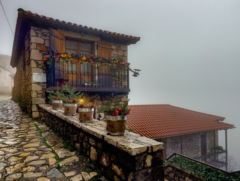 Traditional village of Dimitsana, in Arcadia, Peloponnese, Greece on a beautiful foggy winter day