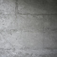 Fototapeta premium A close-up view of a concrete wall with visible cracks and texture