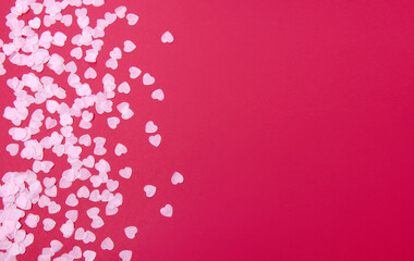 Beautiful and romantic valentines background with present and hearts in red for valentines day or anniversary holiday celebration with copy space