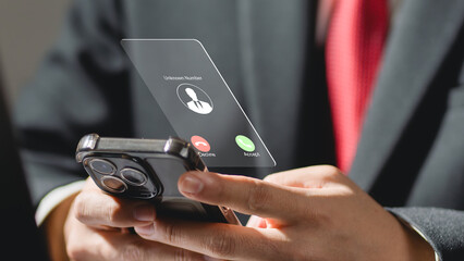 Incoming call from unknown number concept showing businessman holding smartphone with digital interface, symbolizing scam call, phone security, telecommunication risk, and identity protection.