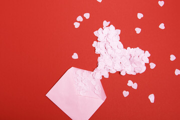 Beautiful and romantic valentines background with present and hearts in red for valentines day or anniversary holiday celebration with copy space