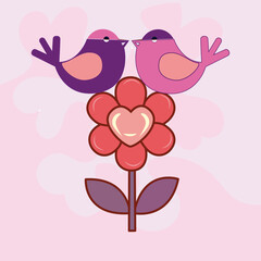 Two love birds sitting above a flower with a heart in the center