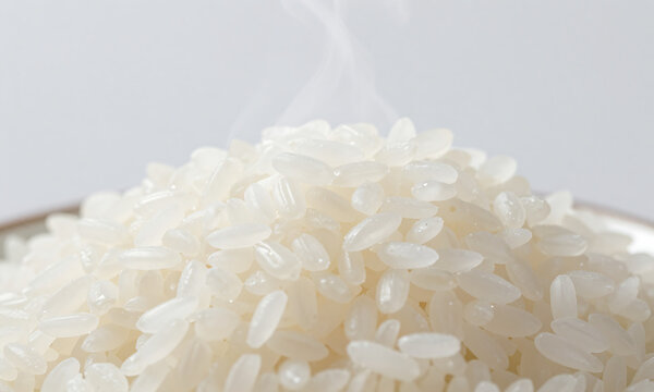 steaming hot raw white rice plain background lit soft natural light creates serene minimalist culinary still