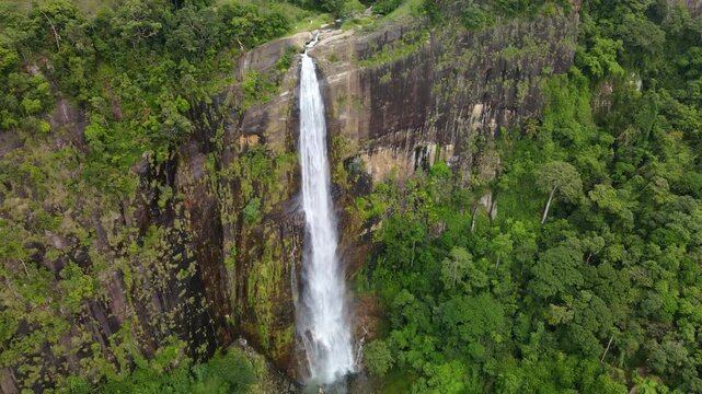 view of Diyaluma Falls in Sri Lanka. Diyaluma Falls is 220 meters high and is the second highest waterfall in Sri Lanka. It is a popular tourist destination on the island.