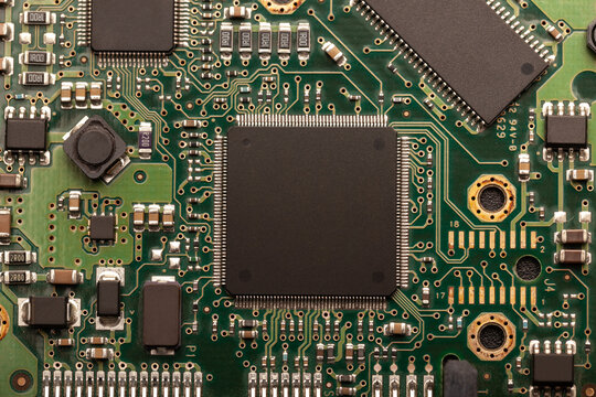 modern printed circuit board with different tracks and chips