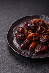 Fototapeta premium Dried sweet dates, natural tropical fruits for a healthy diet. Dried dates