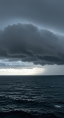 Obraz premium Stormy weather over the vast ocean where dark, heavy clouds merge with rough, churning water, illustrating climate dynamics and energy exchange, vast, nature, circulation