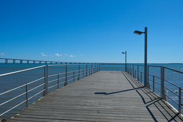 Fototapeta premium Vasco da Gama Bridge and Riverside Walkway at Parque das Nações in Lisbon