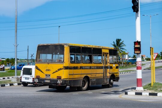 Old yellow Giron VI Ikarus bus in Cuba, slight motion blur effect