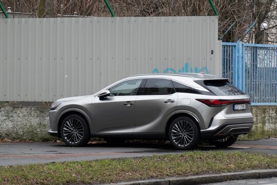 Rear side view of Lexus RX350h hybrid SUV car parked on street