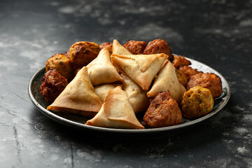 Indian Style Snack Selection with onion bhajis, pakoras and samosas
