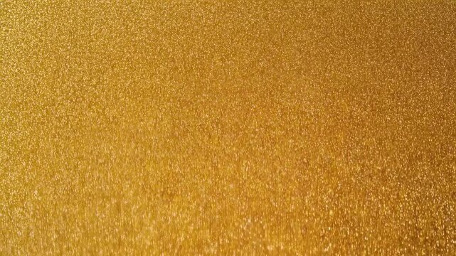 Shimmering gold particles in dynamic downward flow captured in high resolution