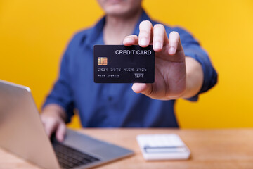 Businessman hands holding credit card and smartphone - payment online - banking online - money transaction