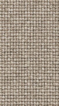 Seamless boucle fabric texture showcasing looped patterns in soft beige tones
