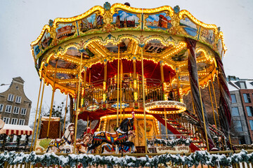Shiny horse carousel in winter Gdansk