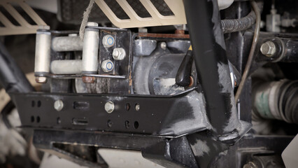 Old car suspensions. Close up car suspension wear and tear parts. CV joint Rubber boot and Control arms bushing Steering rack axles Shock absorber Brake exhaust. Gas Diesel car service repair parts.