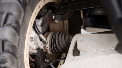 Old car suspensions. Close up car suspension wear and tear parts. CV joint Rubber boot and Control arms bushing Steering rack axles Shock absorber Brake exhaust. Gas Diesel car service repair parts.