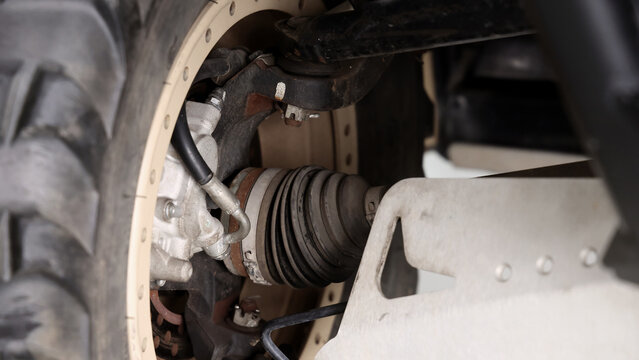 Old car suspensions. Close up car suspension wear and tear parts. CV joint Rubber boot and Control arms bushing Steering rack axles Shock absorber Brake exhaust. Gas Diesel car service repair parts.
