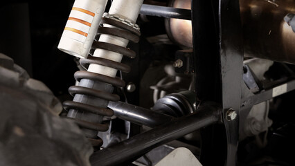 Old car suspensions. Close up car suspension wear and tear parts. CV joint Rubber boot and Control arms bushing Steering rack axles Shock absorber Brake exhaust. Gas Diesel car service repair parts.