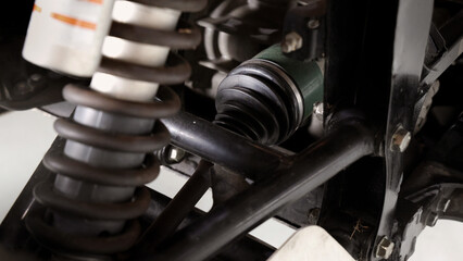 Old car suspensions. Close up car suspension wear and tear parts. CV joint Rubber boot and Control arms bushing Steering rack axles Shock absorber Brake exhaust. Gas Diesel car service repair parts.