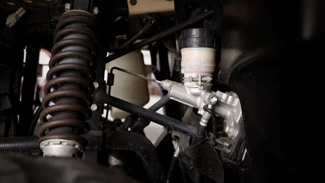 Old car suspensions. Close up car suspension wear and tear parts. CV joint Rubber boot and Control arms bushing Steering rack axles Shock absorber Brake exhaust. Gas Diesel car service repair parts.