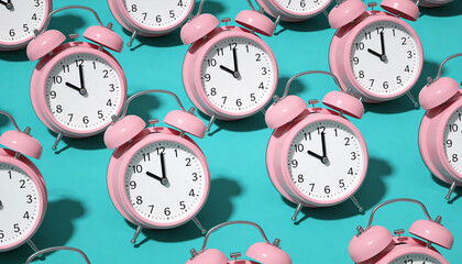 Multiple pink alarm clocks on teal background showing different times