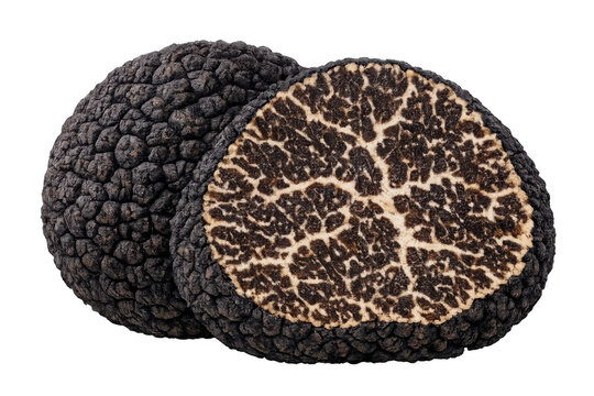 Black truffle showing dark brown peridium and marbling gleba, sliced for gourmet culinary use, transparent background