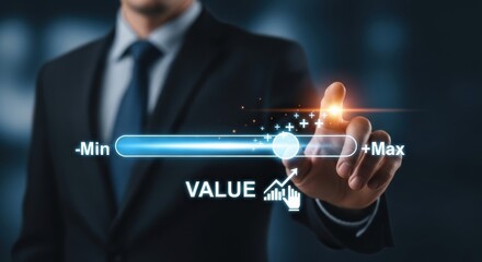 Businessman touching a digital value slider with a blue glowing interface on a dark background.