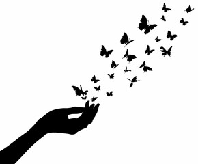 Fototapeta premium Hand releasing butterflies from palm against plain background nature concept minimalist silhouette