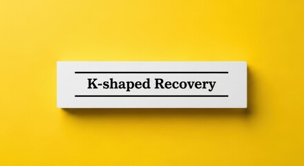 K Shaped Recovery text on paper white background yellow studio shot
