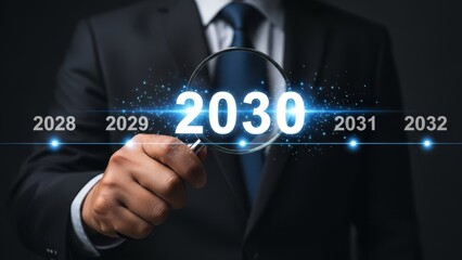 Businessman in formal suit holding a magnifying glass over a futuristic timeline marking the year 2030