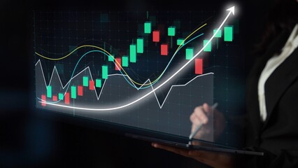 A business professional engages with high-tech financial data on a laptop screen, showcasing vibrant graphs and charts illustrating market trends and analysis. Copula