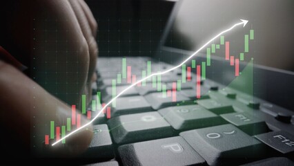 Hands on a keyboard, enhanced with a stock market chart overlay, symbolize investment growth and digital finance trends in a modern workspace environment. Copula