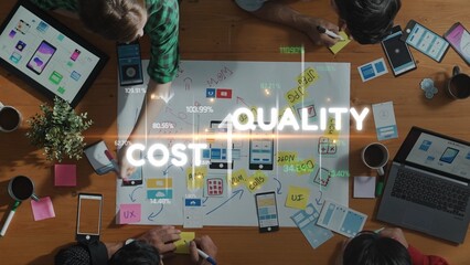 A diverse team engages in a collaborative project at a wooden table, surrounded by design mockups, tech devices, and sticky notes, emphasizing quality and cost factors. Raster