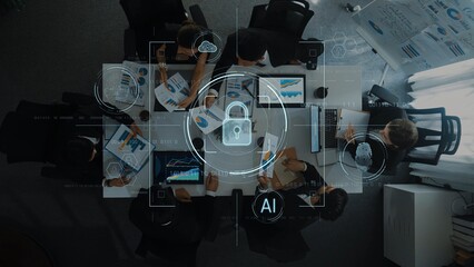 Aerial view of a diverse business team engaged in strategic planning, showcasing data visualization on screens, highlighting technology and collaboration. Raster