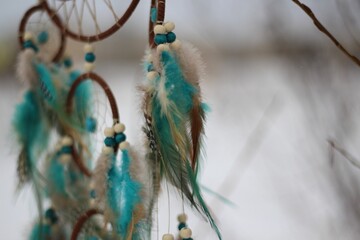 Dream catcher in winter outdoor season snow mascot bohemian style ethnic object hanging on the tree nature cozy calm photo beautiful background lifestyle thing boho lovely craft dreamcatcher