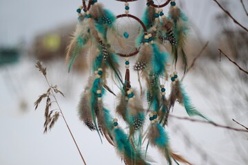 Dream catcher in winter outdoor season snow mascot bohemian style ethnic object hanging on the tree nature cozy calm photo beautiful background lifestyle thing boho lovely craft dreamcatcher