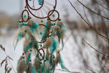 Dream catcher in winter outdoor season snow mascot bohemian style ethnic object hanging on the tree nature cozy calm photo beautiful background lifestyle thing boho lovely craft dreamcatcher