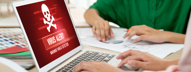 Virus warning alert on computer screen detected brisk cyber threat , hacker, computer virus and malware